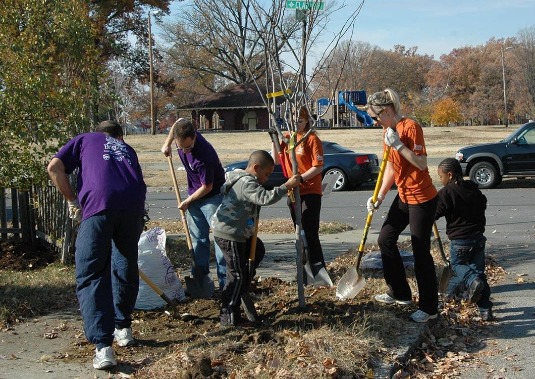 Volunteers planting a tree